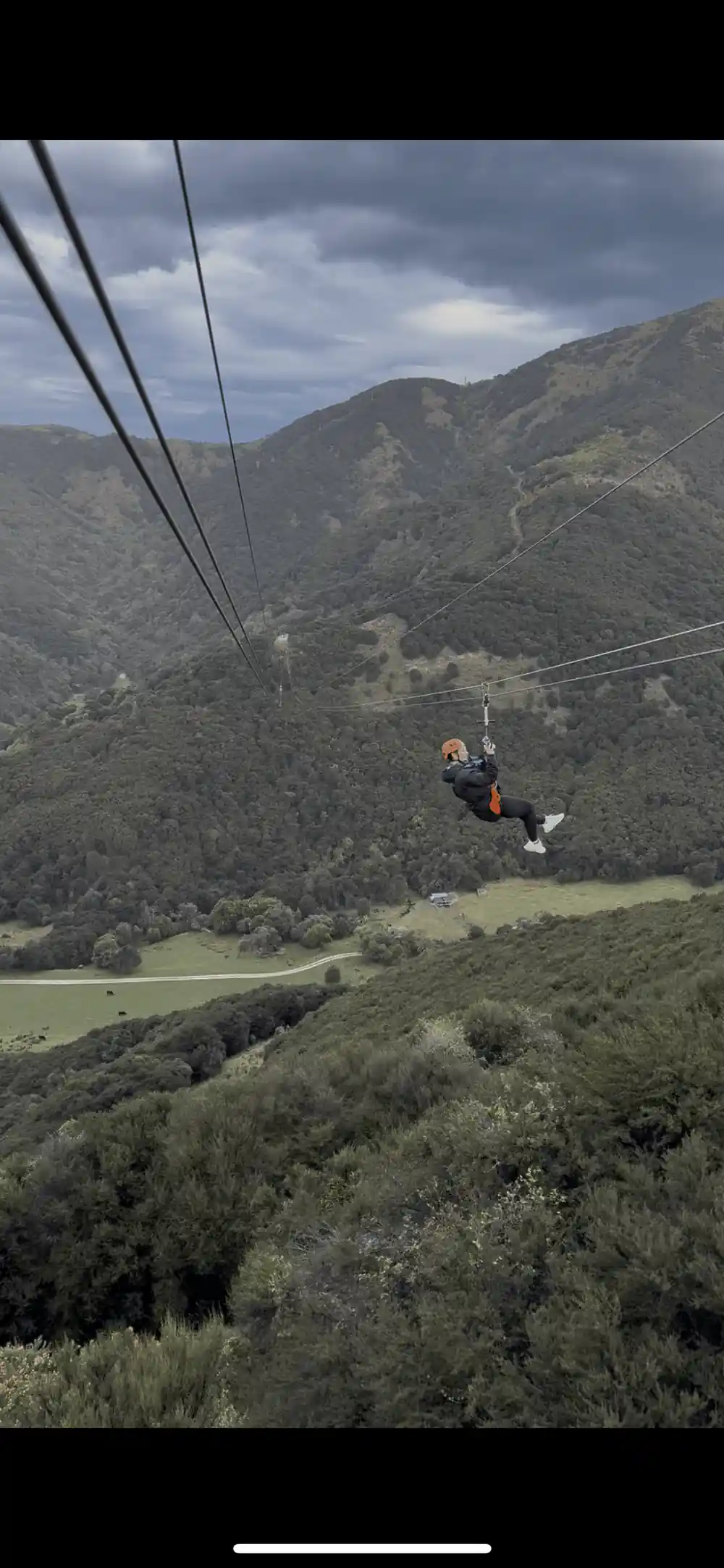 A rider high above the farmland and the sea