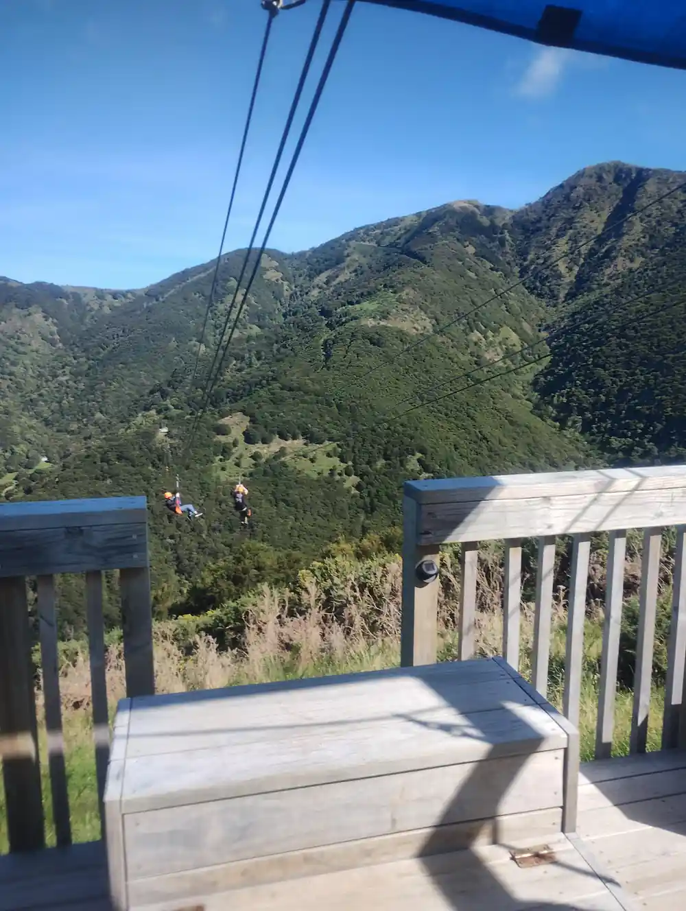 Steep green ridges above the platform